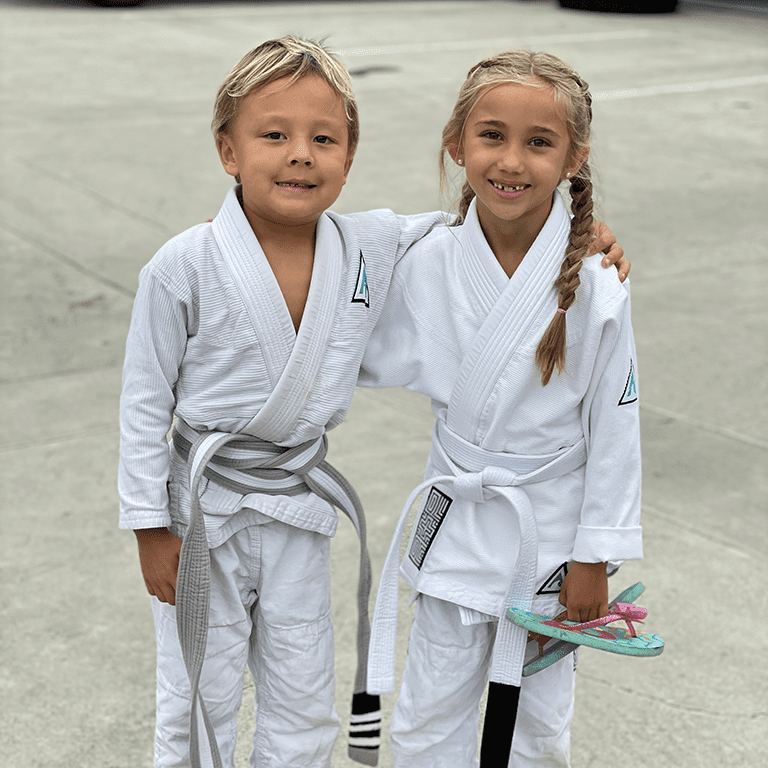 Two Kids in Karate Uniforms